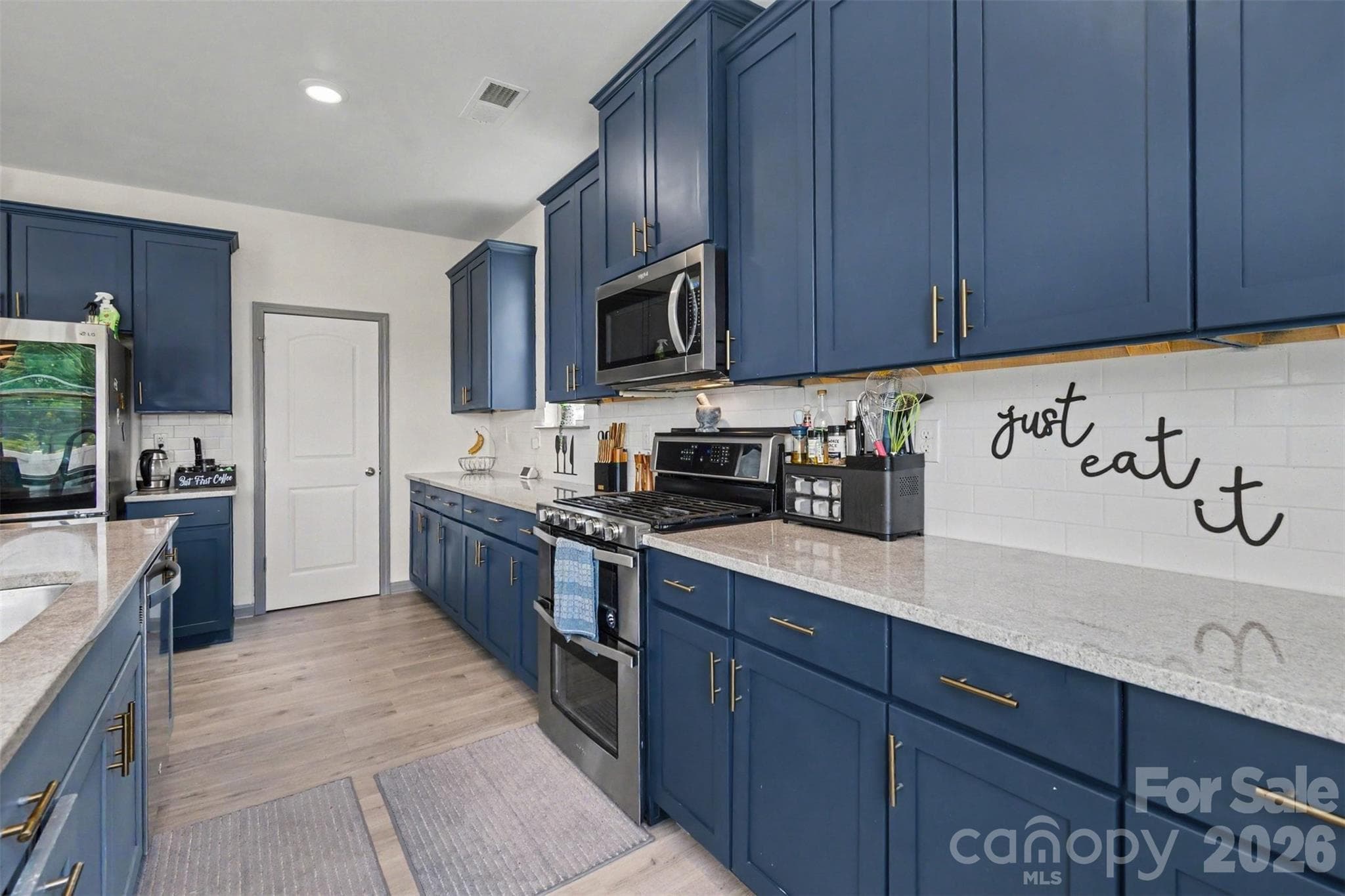 Can you see yourself creating culinary masterpieces on the copious countertops? - 2055 Yearden Lane, Monroe