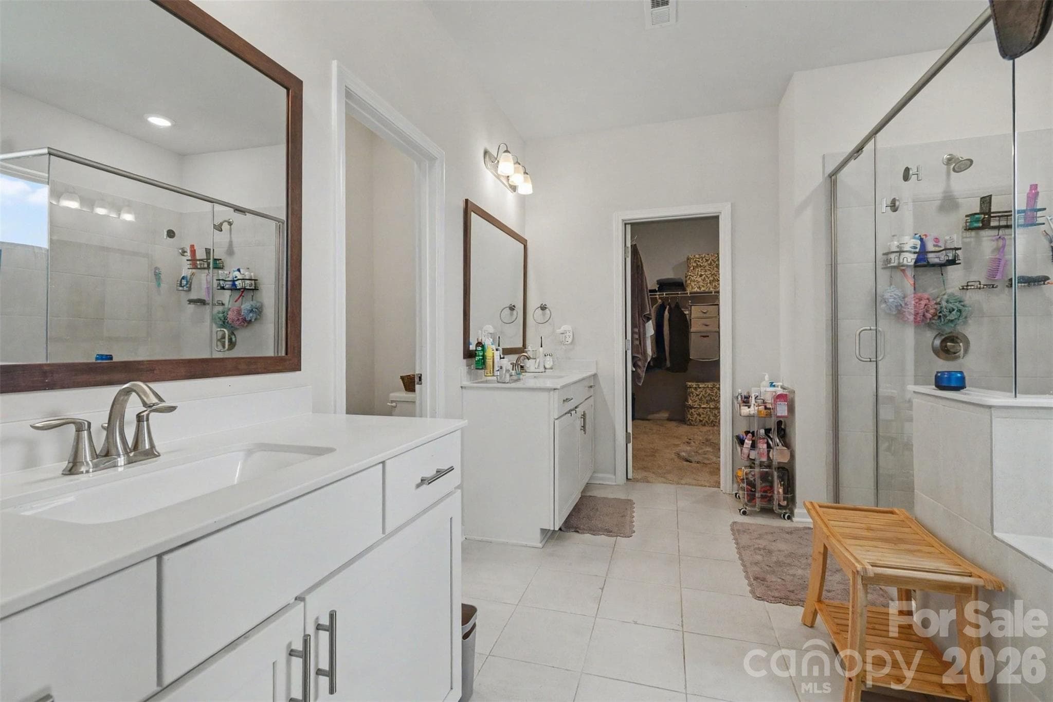 The primary bath features tiled flooring, separate solid surface vanities and lots of lighting... - 2055 Yearden Lane, Monroe