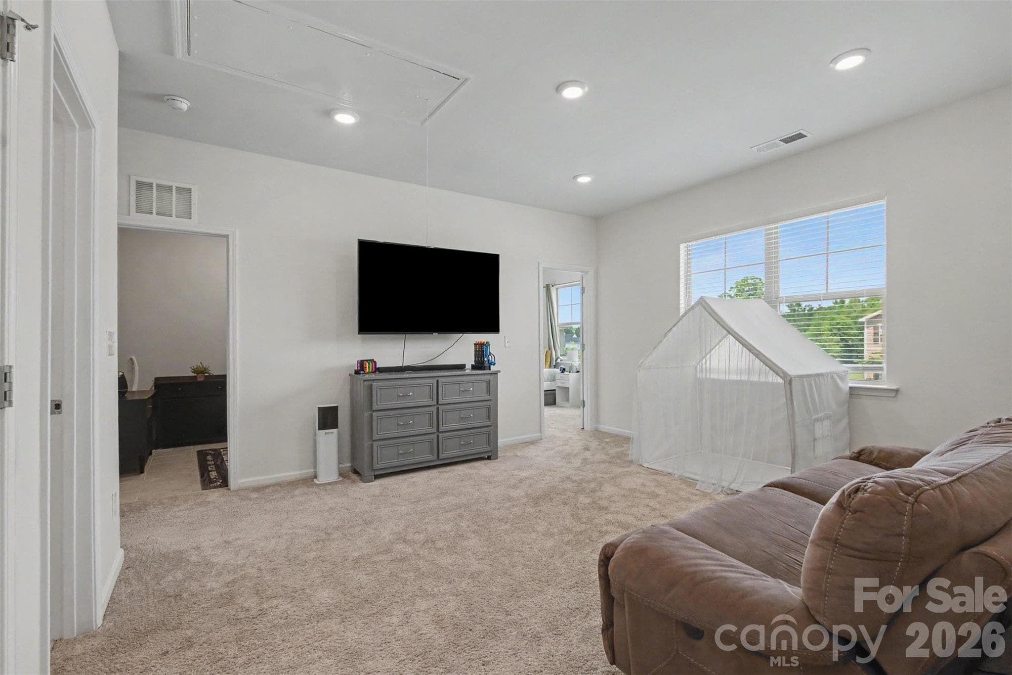 The loft is a wonderful place for everyone inhabiting the bedrooms to come together for entertainment. It is freshly painted and is adorned with both recessed lighting and natural light! - 2055 Yearden Lane, Monroe