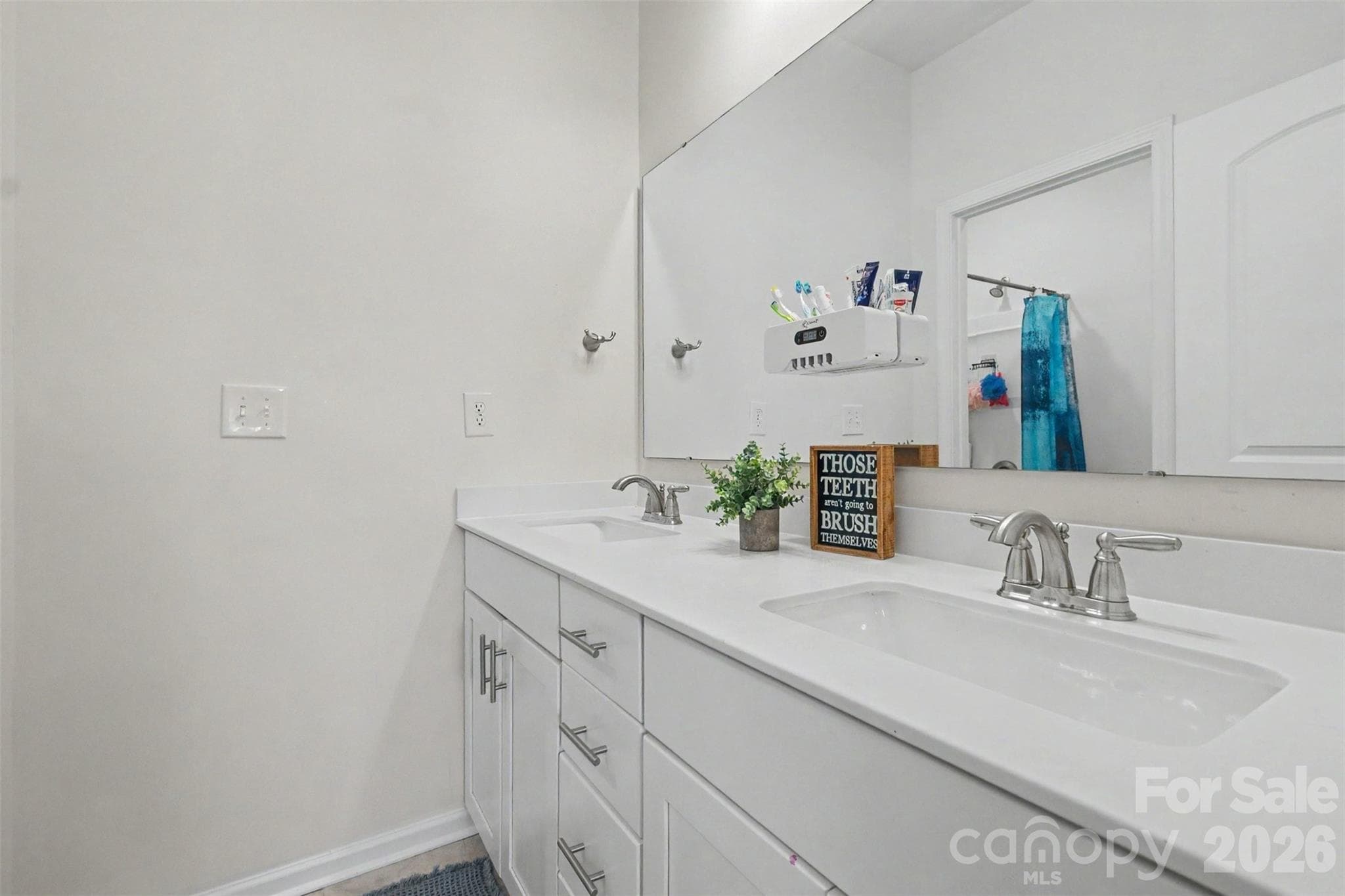 The second bathroom features a solid dual vanity with lots of drawers and cabinets. - 2055 Yearden Lane, Monroe