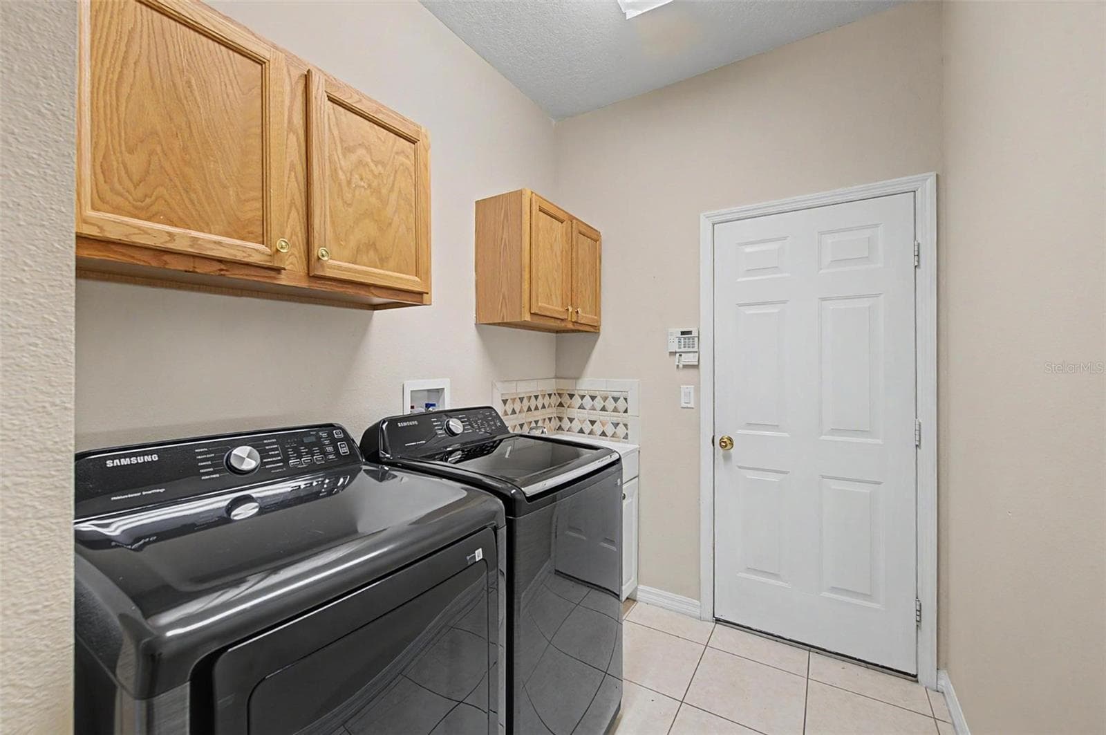 interior laundry room - 2811 RAVENDALE LN, HOLIDAY