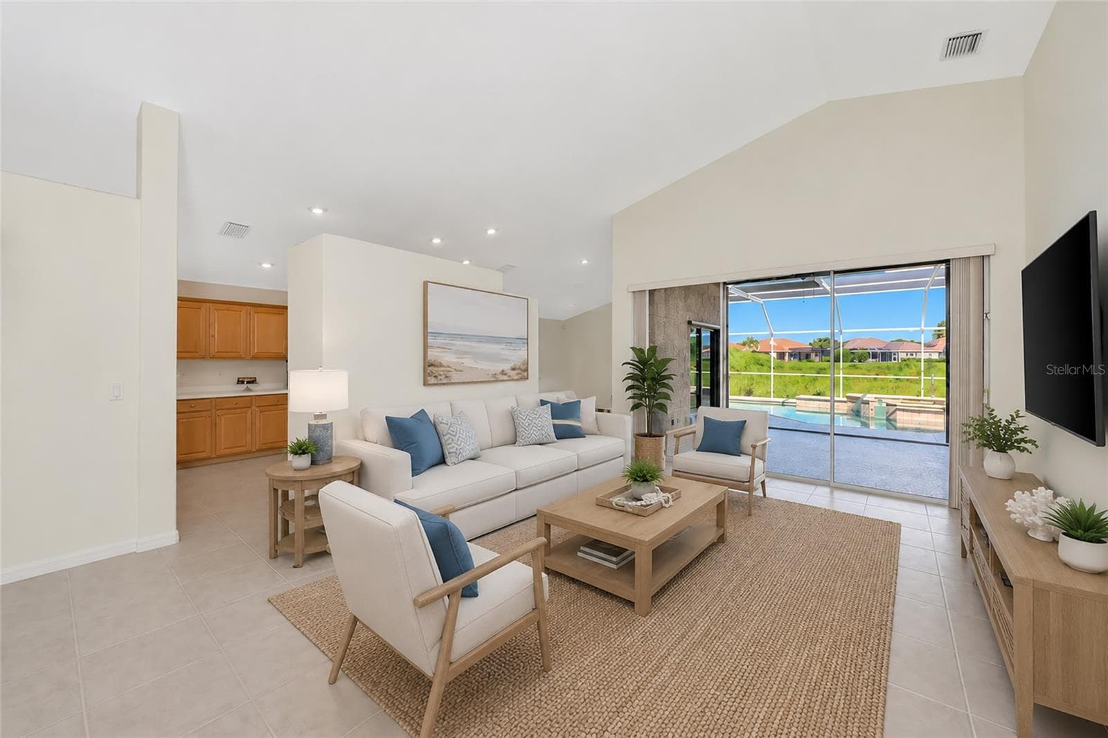 Virtual Staged. Living room view to pool & spa. - 5133 FLAGSTONE DR, SARASOTA