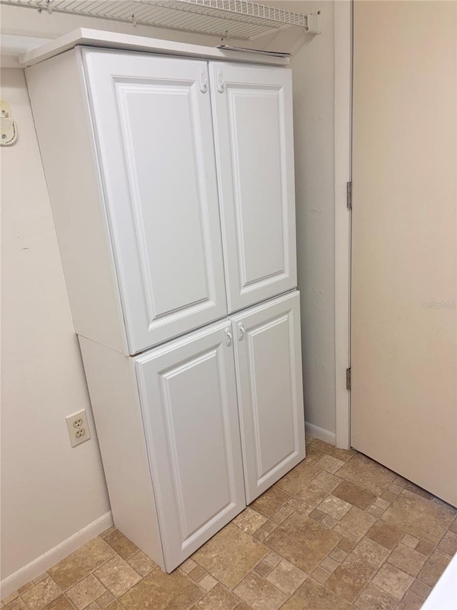 Cabinet in Laundry Room - 4460 FAIRWAYS BLVD #407, BRADENTON
