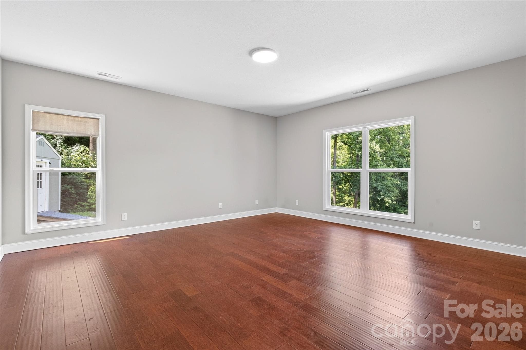 Primary bedroom offers plenty of natural lighting. - 771 Sally Gap Road, Old Fort