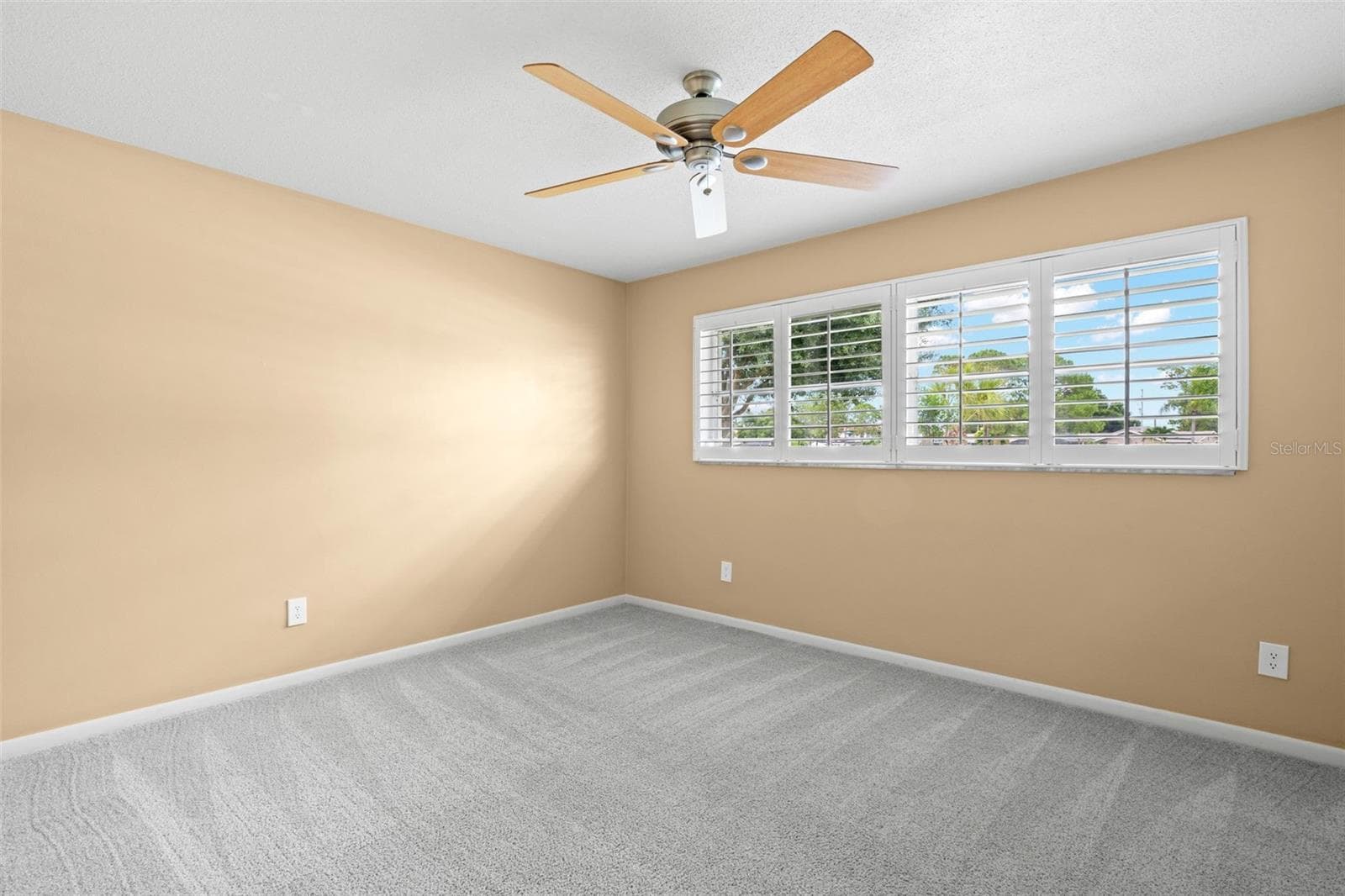 Bedroom 2 - ceiling fan and plantation shutters - 6729 TEQUESTA DR, SEMINOLE