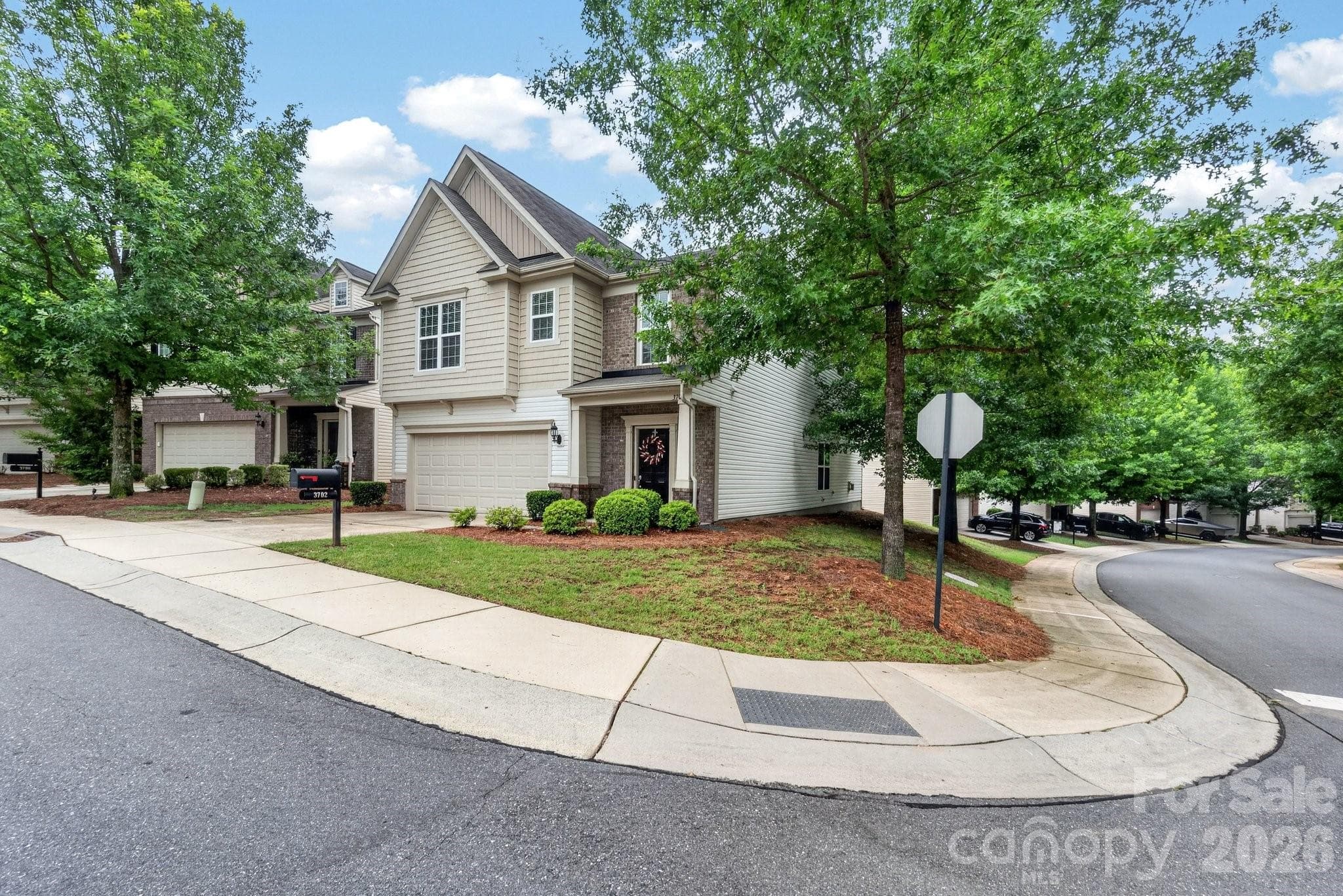 The property is situated on a corner lot with mature trees and well maintained shrubbery on Park South Station Blvd and Royal George Ave. - Charlotte