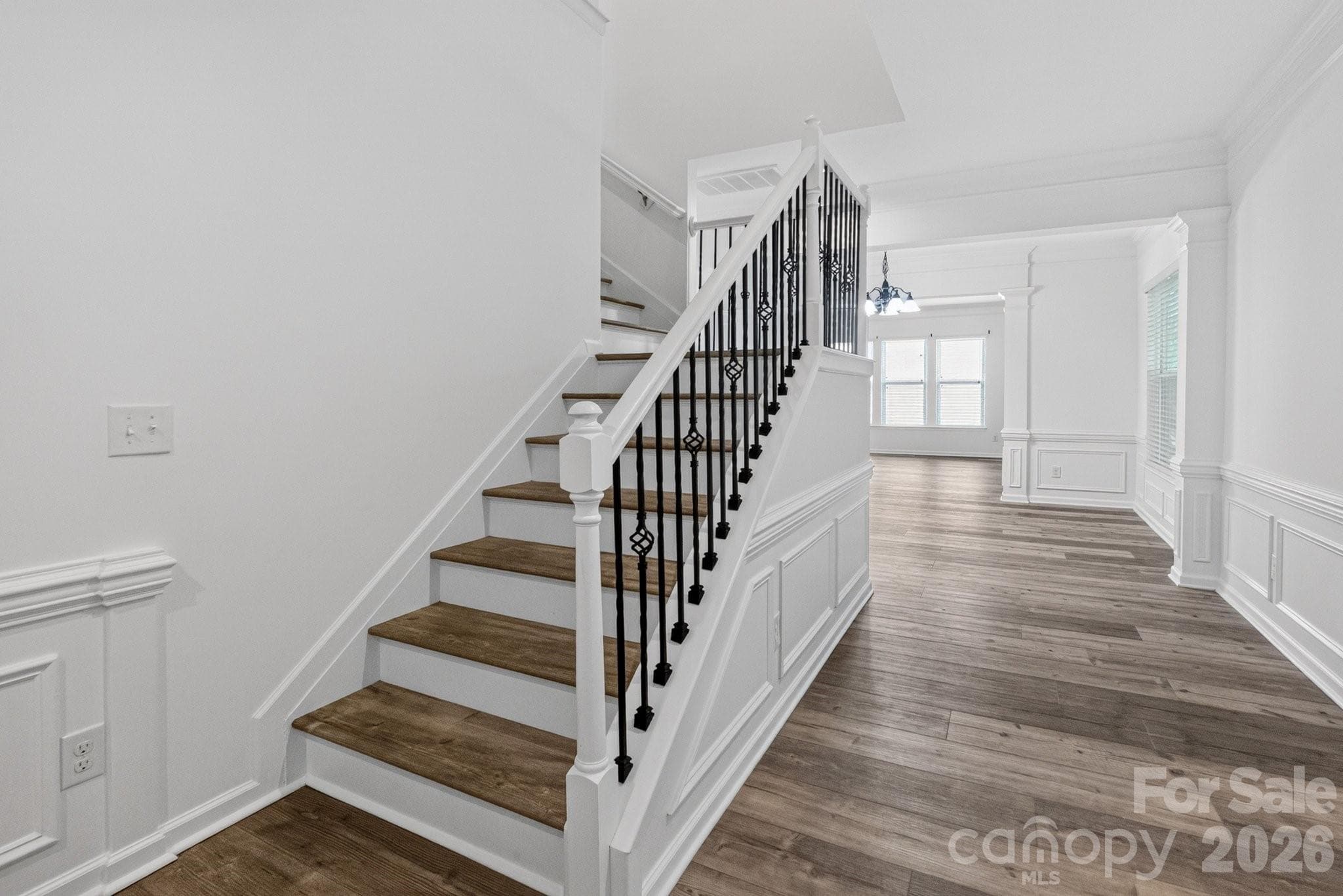 A beautiful staircase leads you to the second story bedrooms. - Charlotte