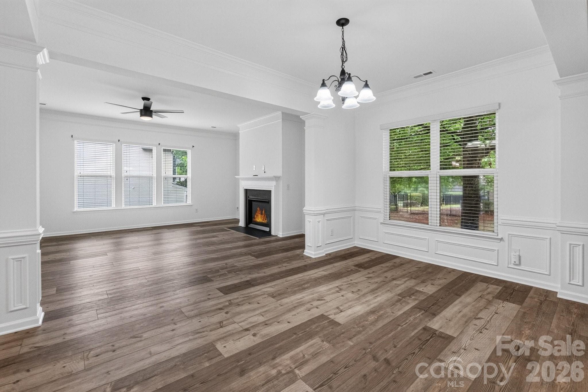 The spacious dining and family room are adjacent with plenty of natural light. - Charlotte