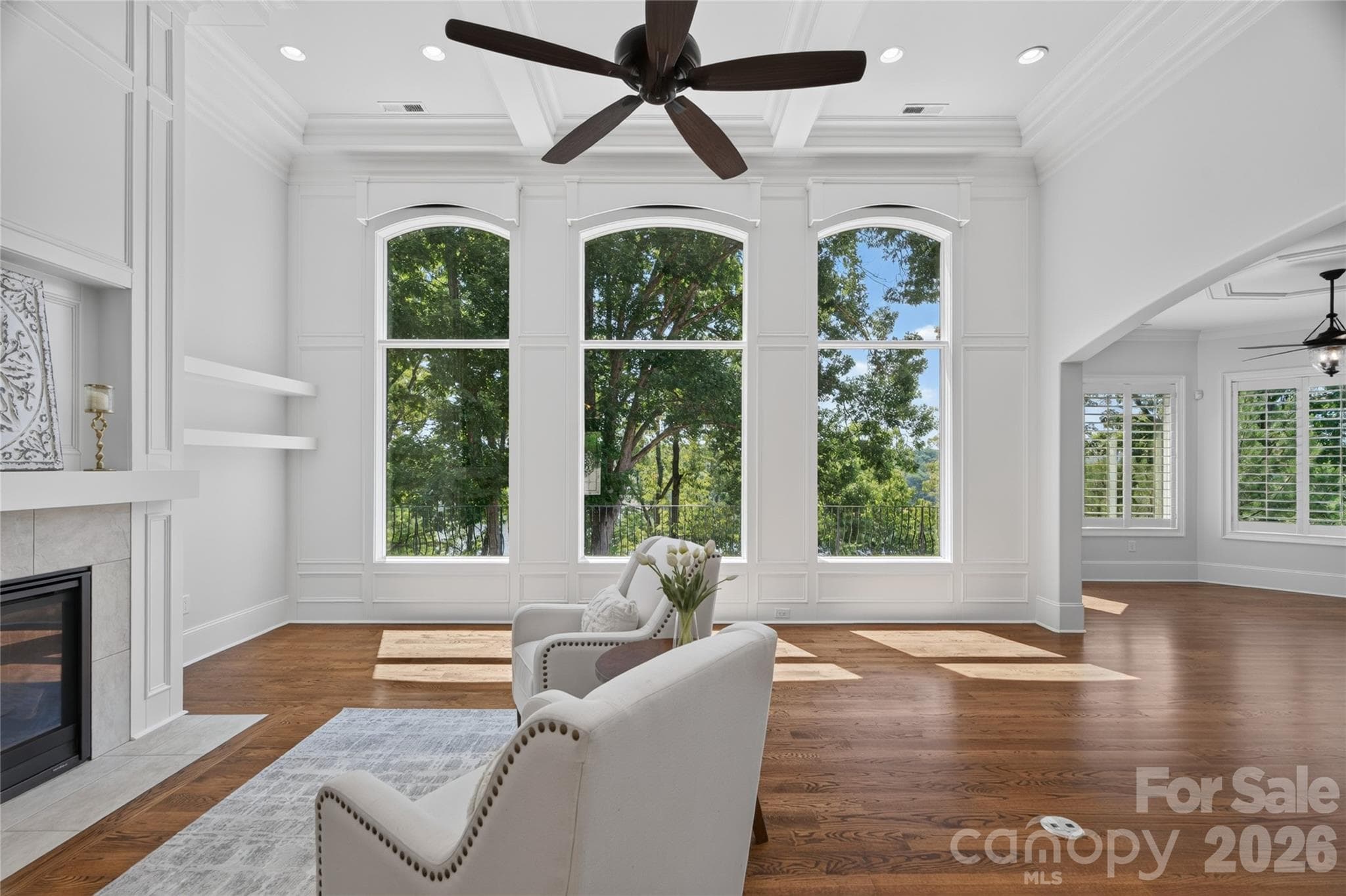 Wall of windows have motorized shades in GR with remote - Belmont