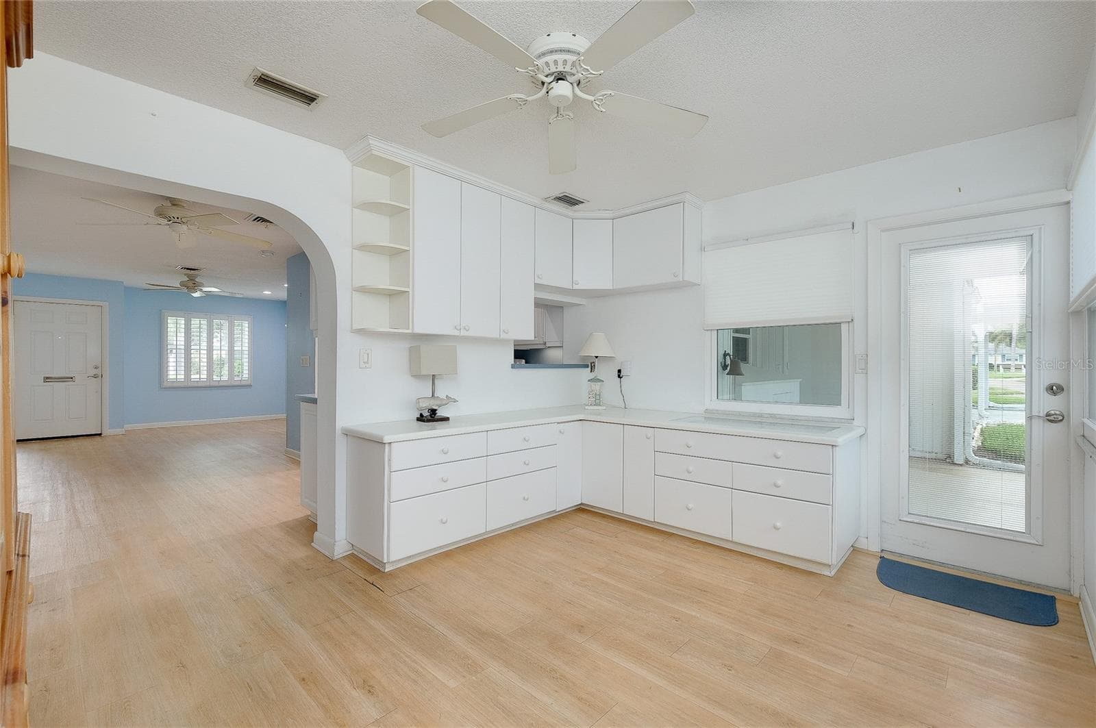 Enclosed Florida room with built-in cabinetry and pass through from kitchen - 112 THE CORSO #112, VENICE