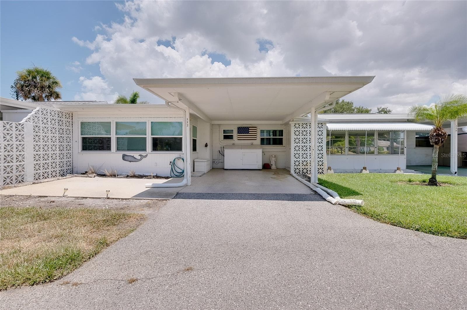 Carport and patio are to the rear of the villa. - 112 THE CORSO #112, VENICE