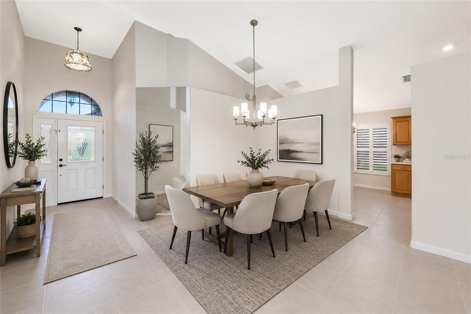 Virtual staged. Cathedral ceiling over foyer and dining. - 5133 FLAGSTONE DR, SARASOTA