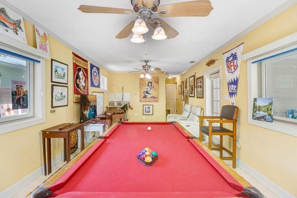 Another view of the game room with plenty of space for a pool table. - 1976 DUNLOE CIR, DUNEDIN