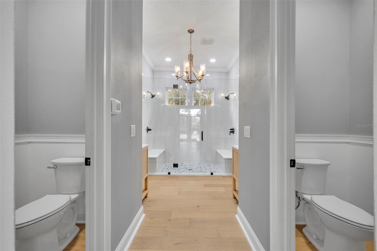 First Floor Primary Bathroom duel toilet closets enclose - 807 OAK SHADOWS RD, CELEBRATION