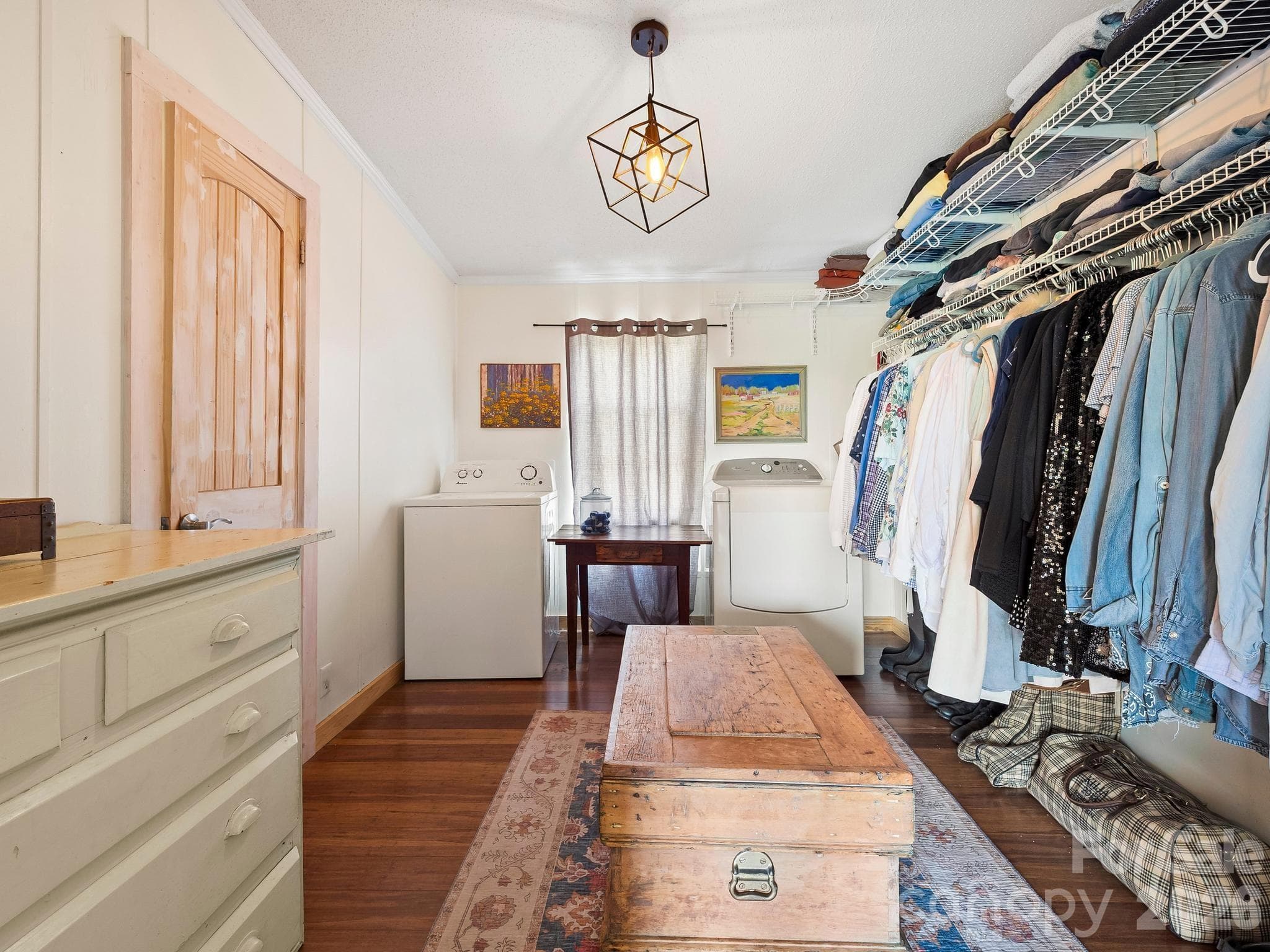 Walk-in closet in the primary bedroom is where the washer/dryer are located. - 1541 Sandy Springs Road, Rutherfordton