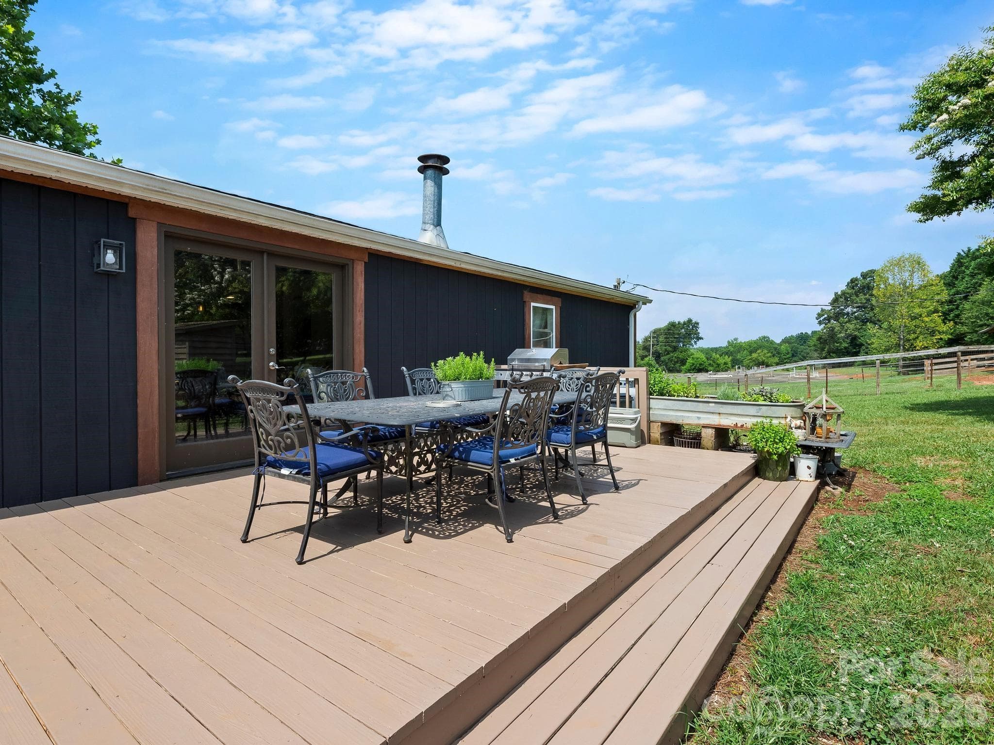 Sliding doors open out to the large back deck. - 1541 Sandy Springs Road, Rutherfordton