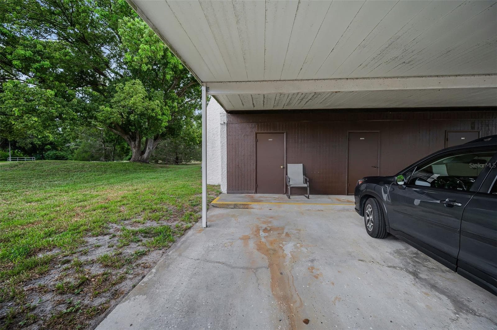 Covered carport - 3097 MISSION GROVE DR, PALM HARBOR