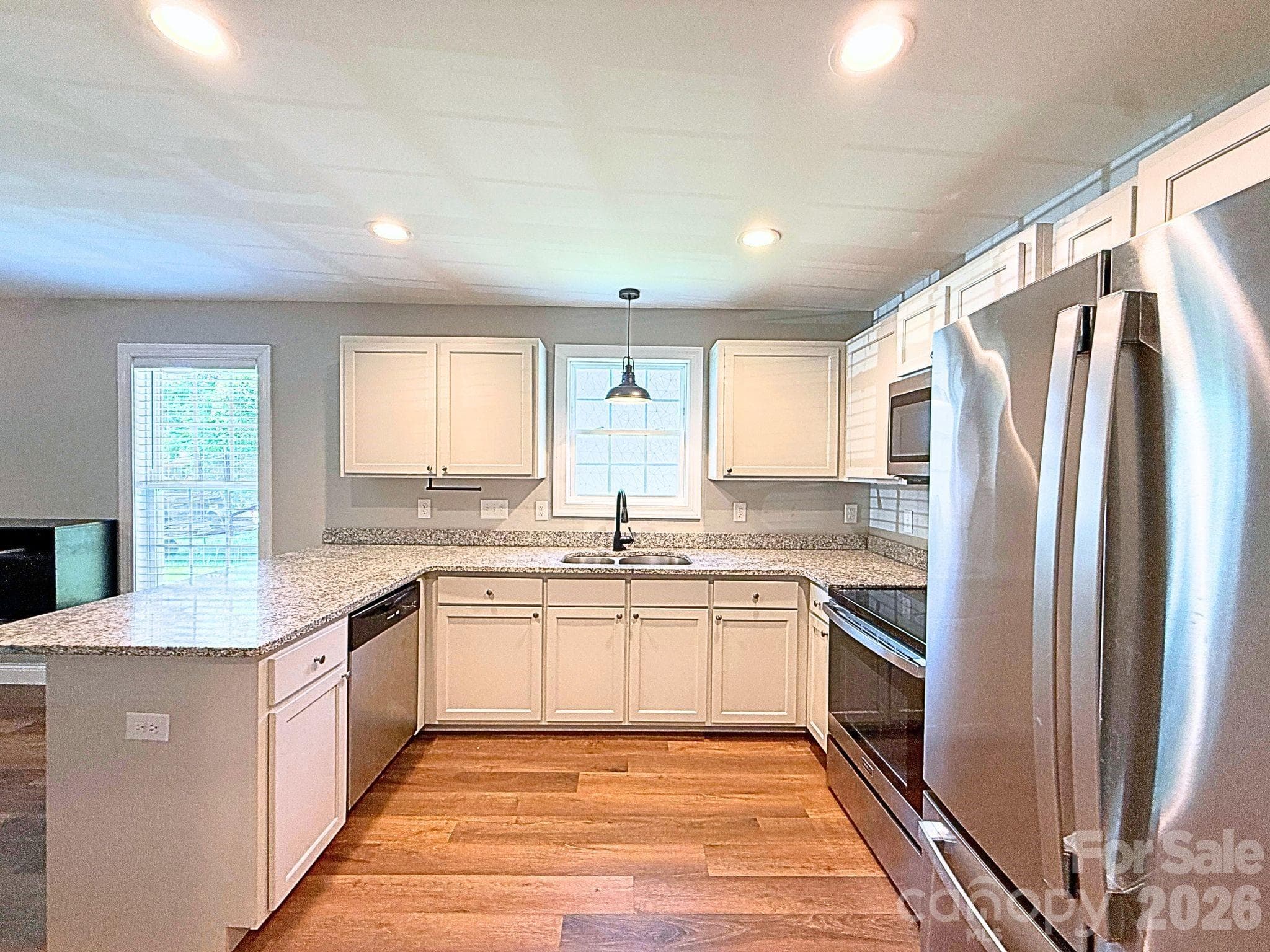 Kitchen – Spacious kitchen with abundant cabinetry, granite countertops, and an open design that overlooks the main living area. - Chester