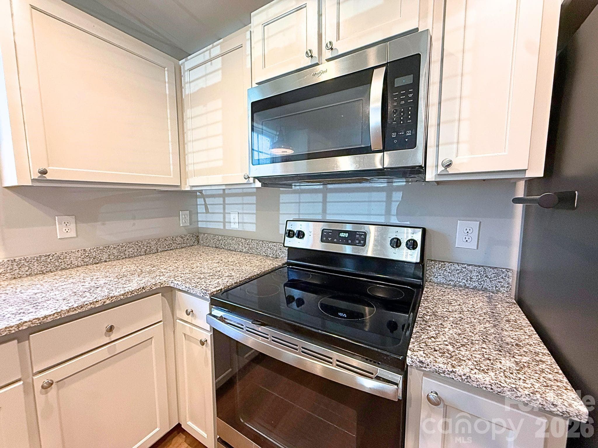 Kitchen – Modern kitchen equipped with stainless steel appliances, granite countertops, abundant cabinetry, and a sleek, functional workspace. - Chester