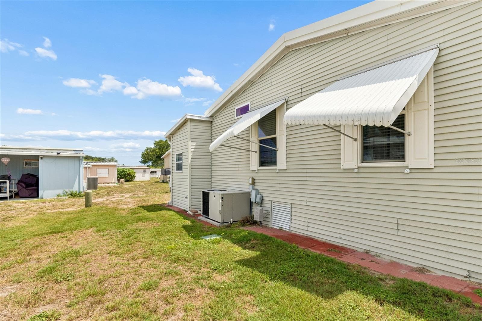 Rear of home - 9790 66TH ST N #252, PINELLAS PARK