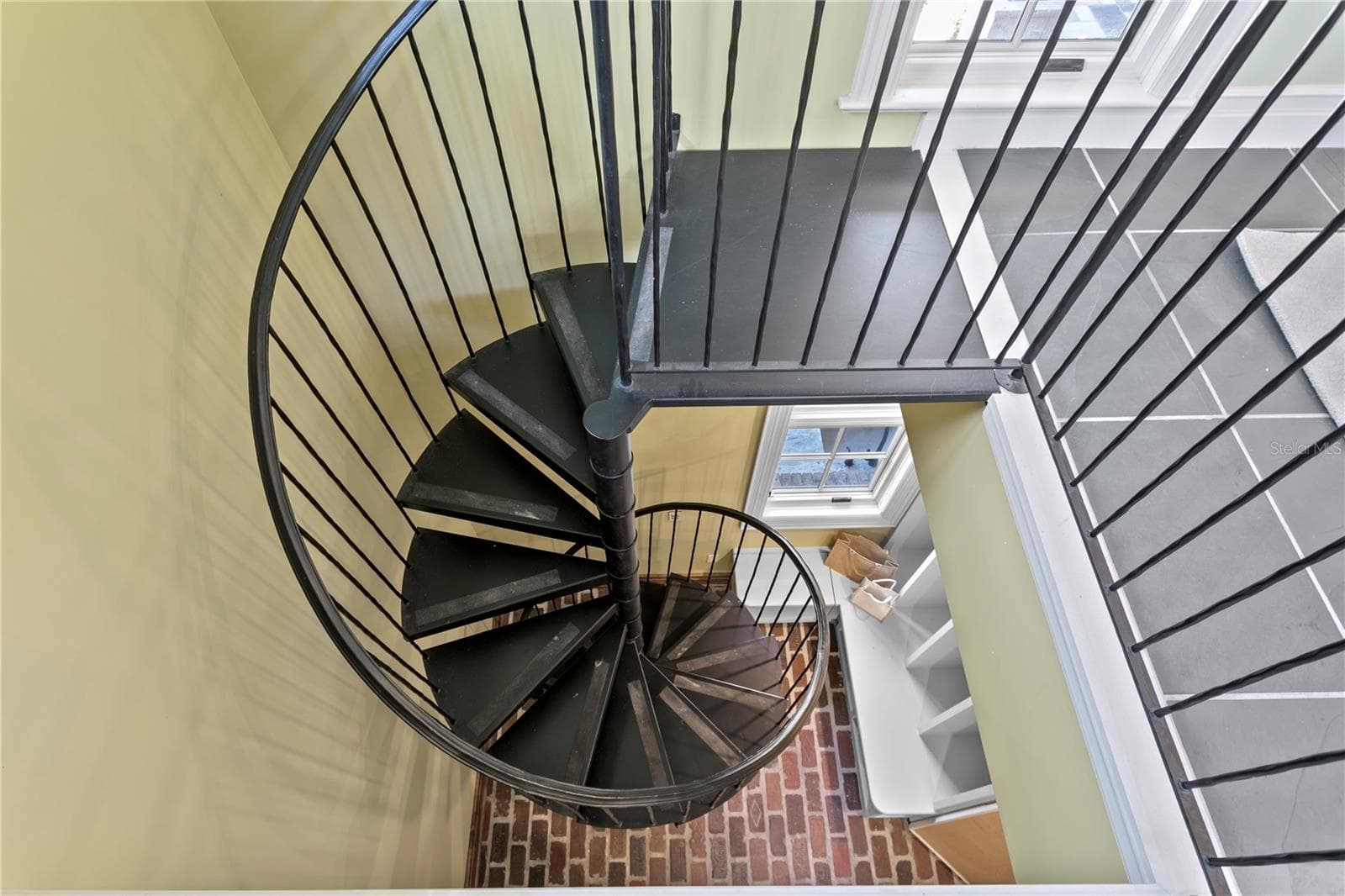Spiral staircase in the mudroom up to the office/gym - 401 SNELL ISLE BLVD NE, ST PETERSBURG