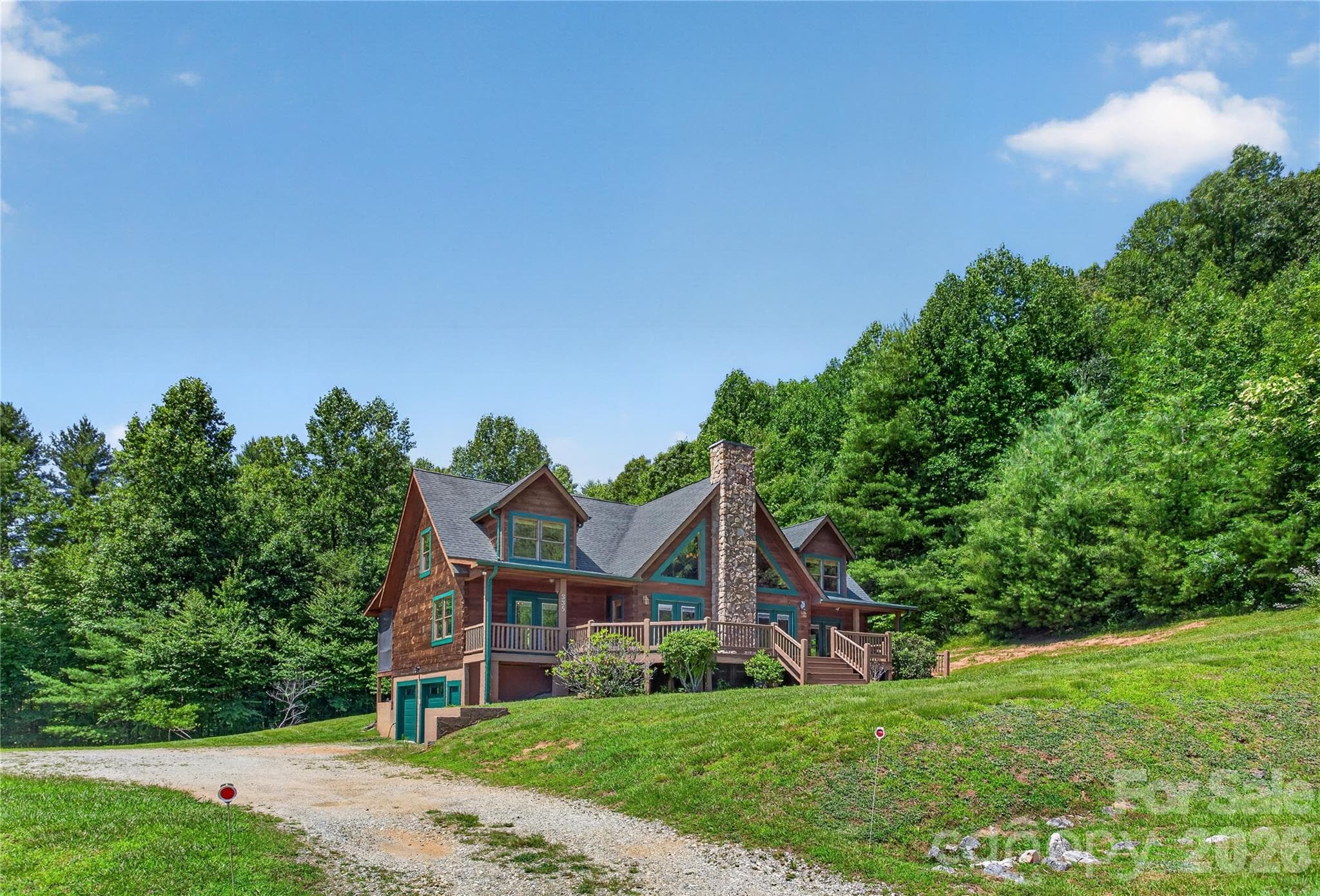 View from Whites Lake Blvd, looking up the driveway. - 335 Whites Lake Boulevard, Saluda