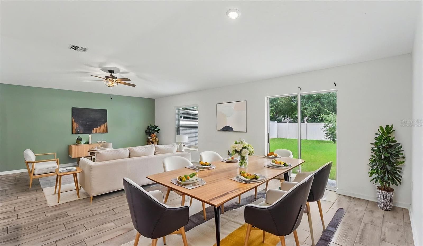 Virtually staged photo. Living room option with dining space combo. - 272 PERSHING ST, BARTOW