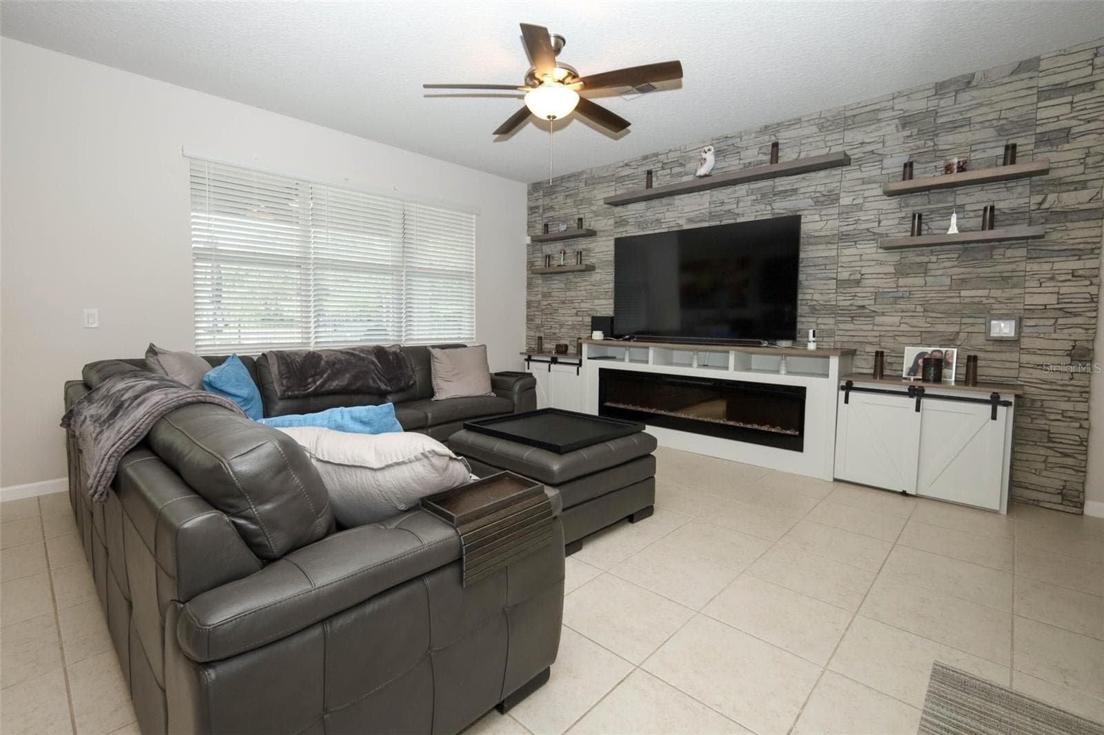 Great room / Custom built entertainment center / electric fireplace - 3980 LIGHTNING CT, SANFORD