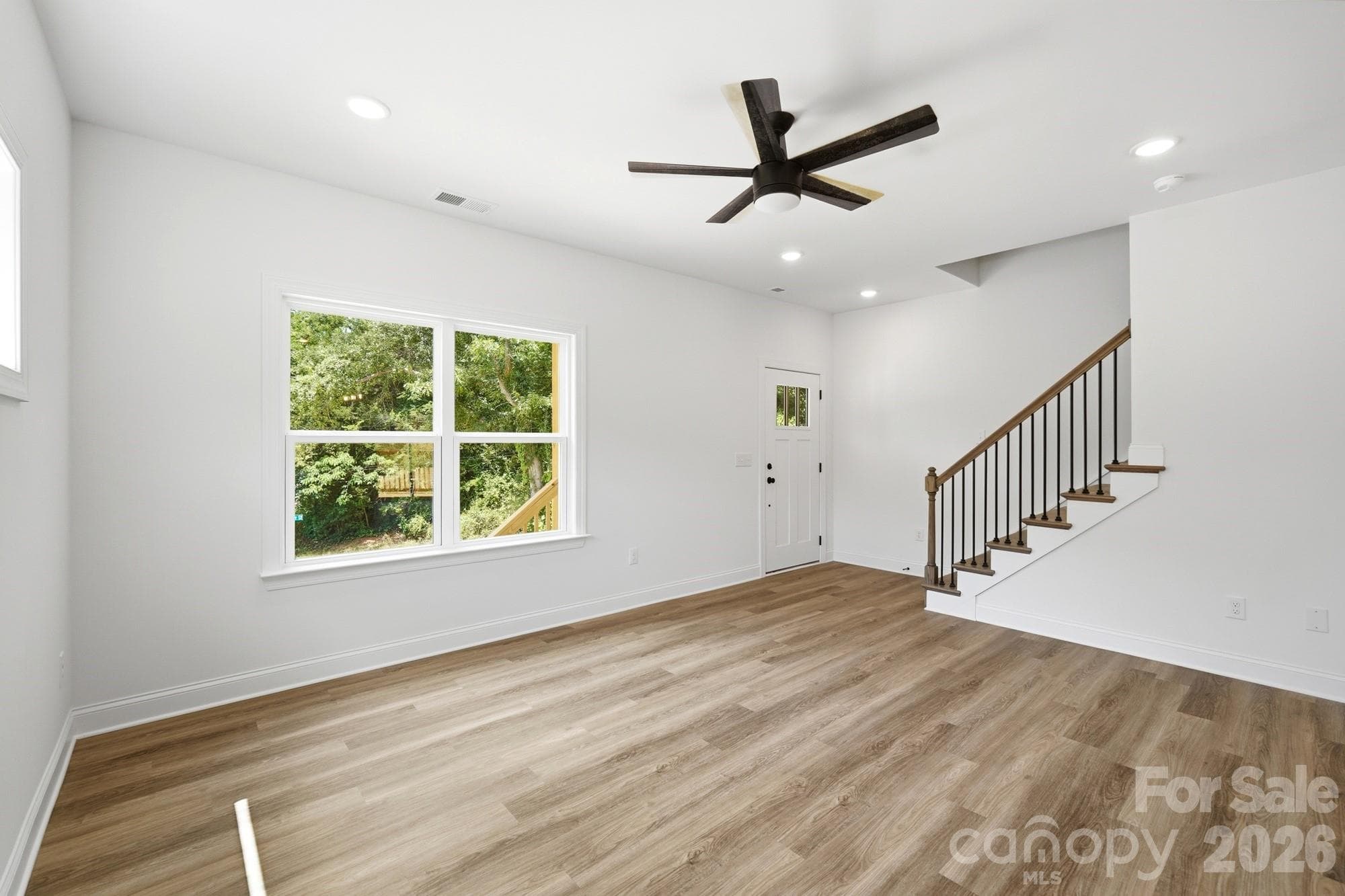 View from Kitchen to the Front Door & Stairs to Upper Level - Hickory