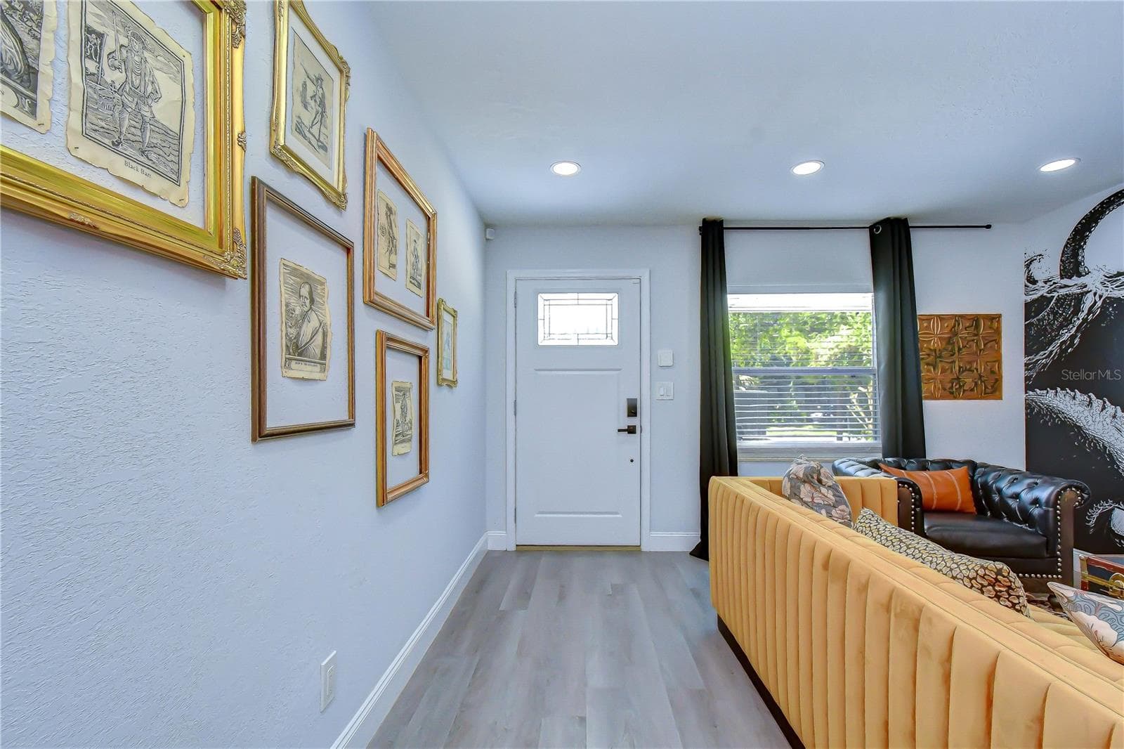 Front door entrance leads into the living room - 2714 E 98TH AVE, TAMPA