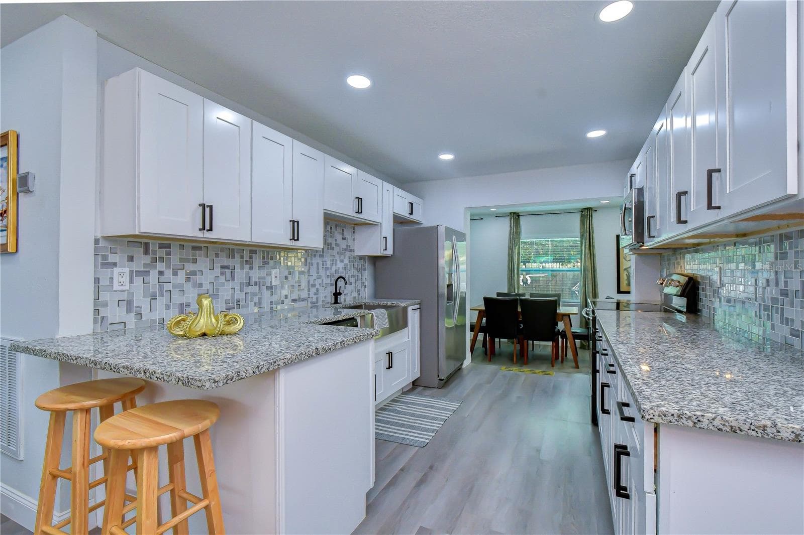 updated kitchen with granite counters and stainless steel appliances - 2714 E 98TH AVE, TAMPA