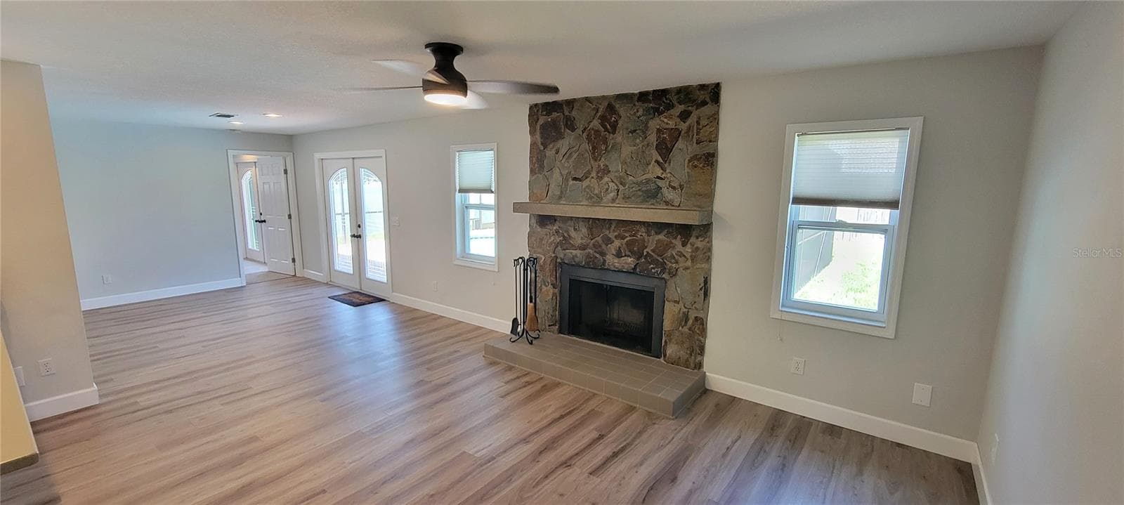 Family room by the kitchen with a wood burning fireplace for those cool winter nights! - 7801 17TH WAY N, ST PETERSBURG
