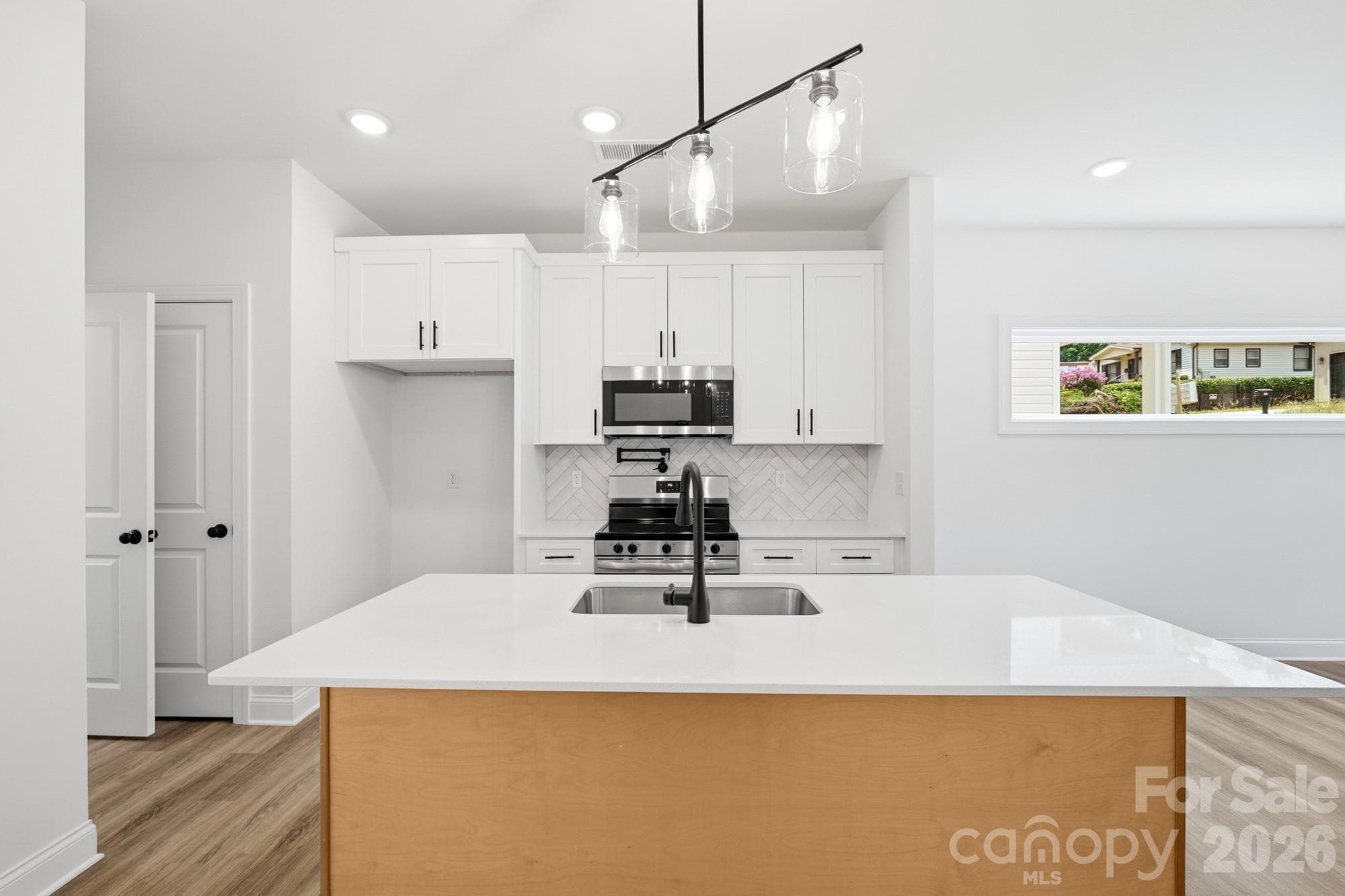 View of Kitchen with Kitchen Island Breakfast Bar - 116 7th Avenue SE, Hickory