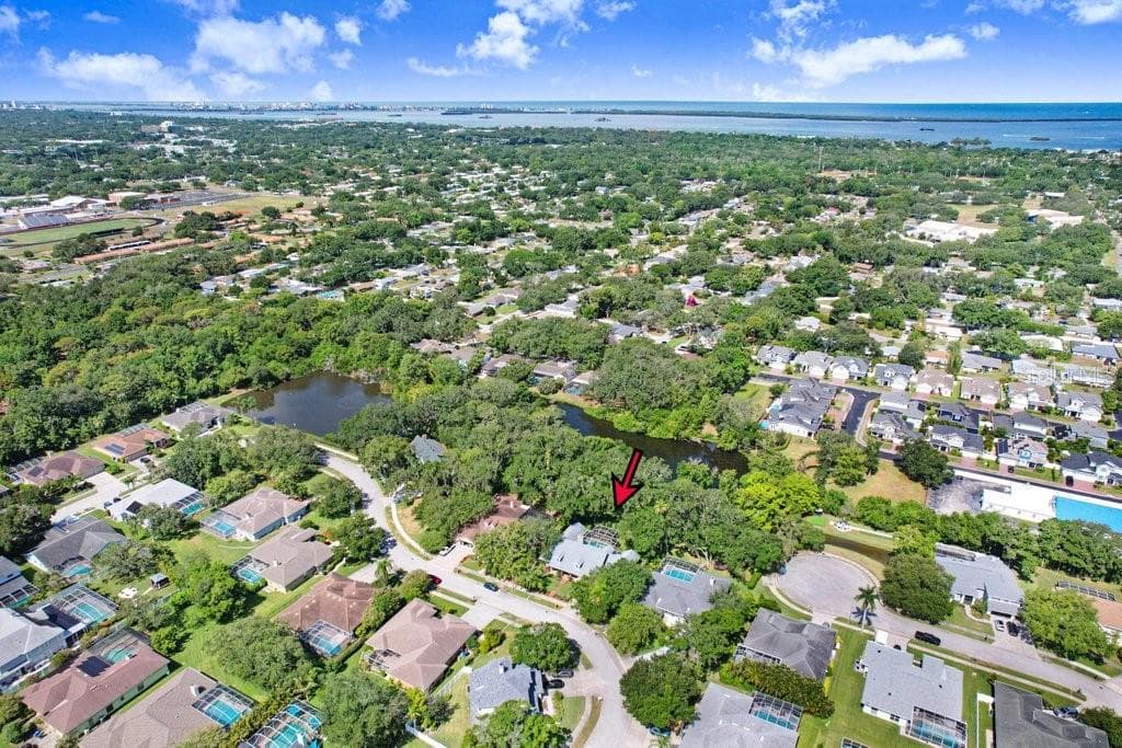 Another drone view of home and neighborhood. - 1976 DUNLOE CIR, DUNEDIN
