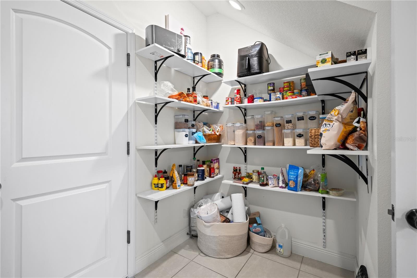 Custom built storage shelves in laundry room - 11567 GALLATIN TRL, PARRISH