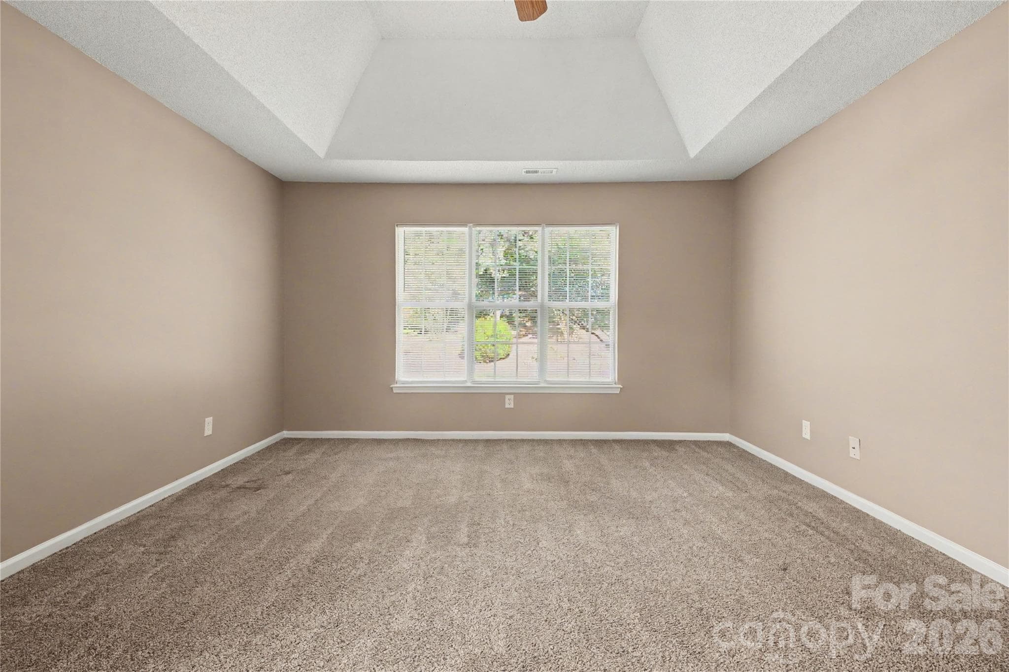 Primary bedroom with trey ceiling and fan - 3786 Sedgewick Street SW, Concord