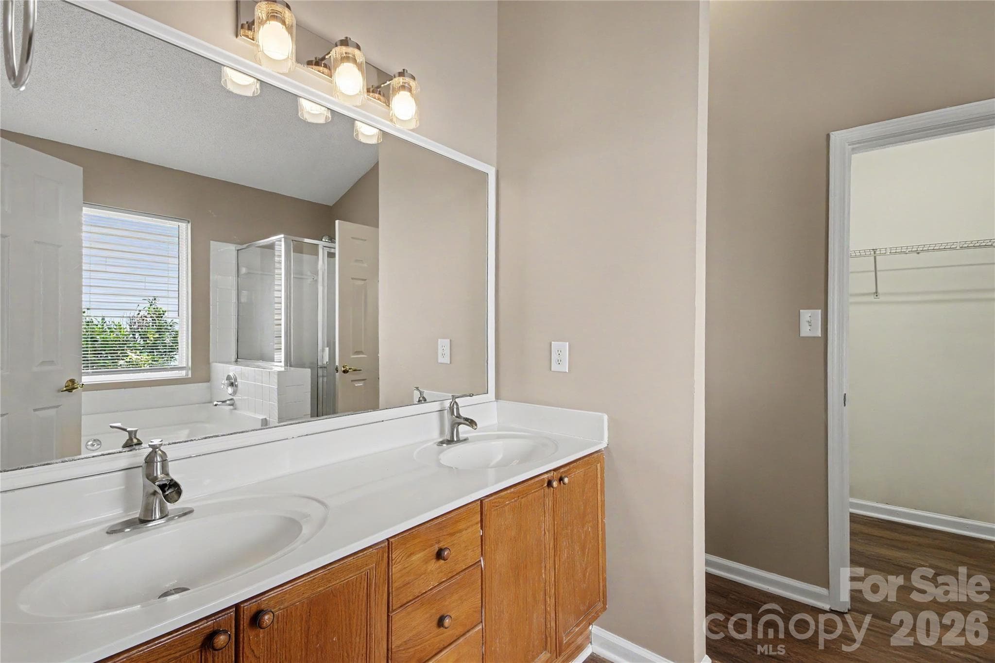 Primary bath with dual vanity and redesigned mirrors walk-in closet and seperate shower/garden tub - 3786 Sedgewick Street SW, Concord