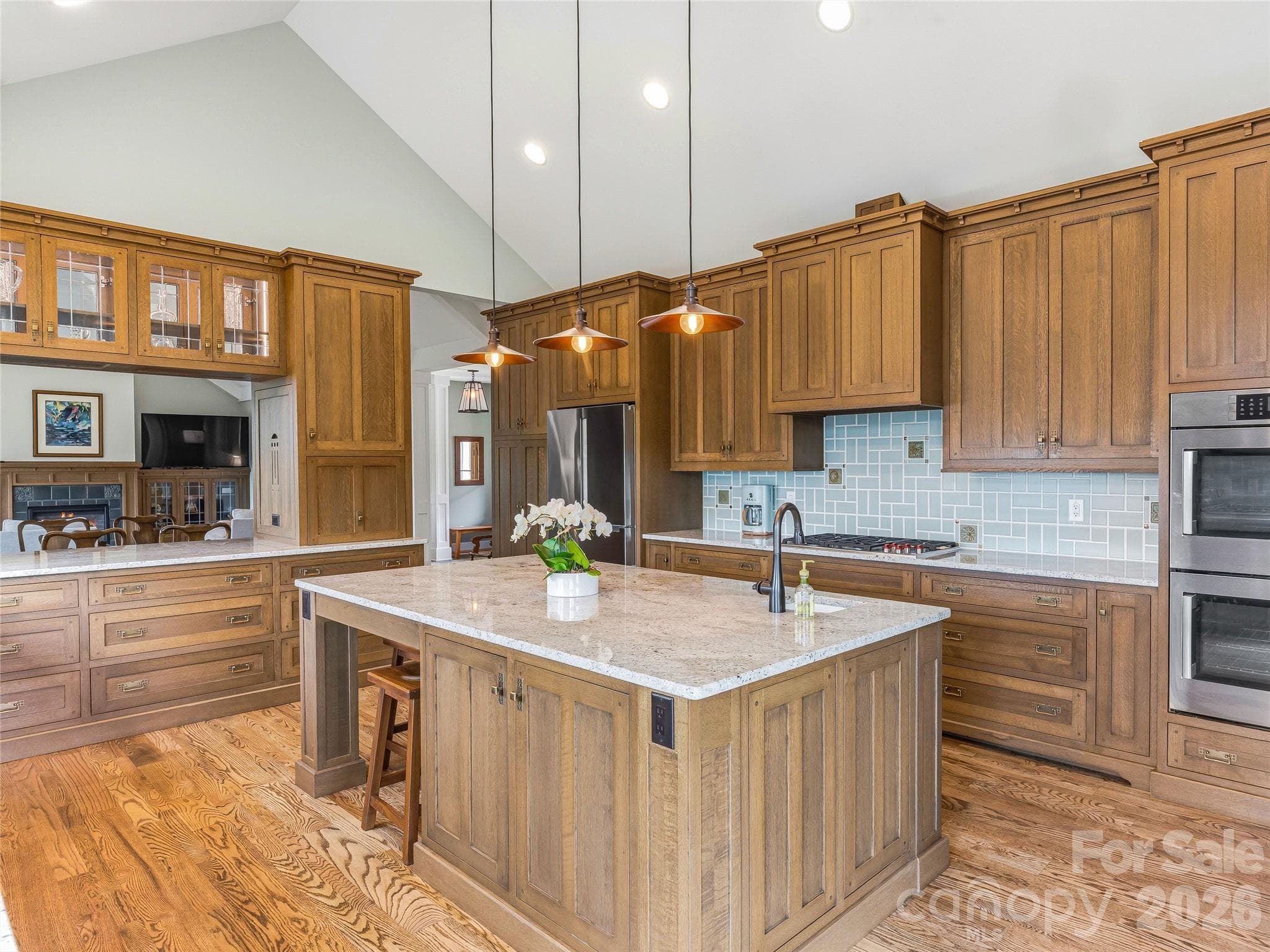 Large kitchen island with sitting area, storage, prep sink and 5-burner Wolfe gas range - Asheville