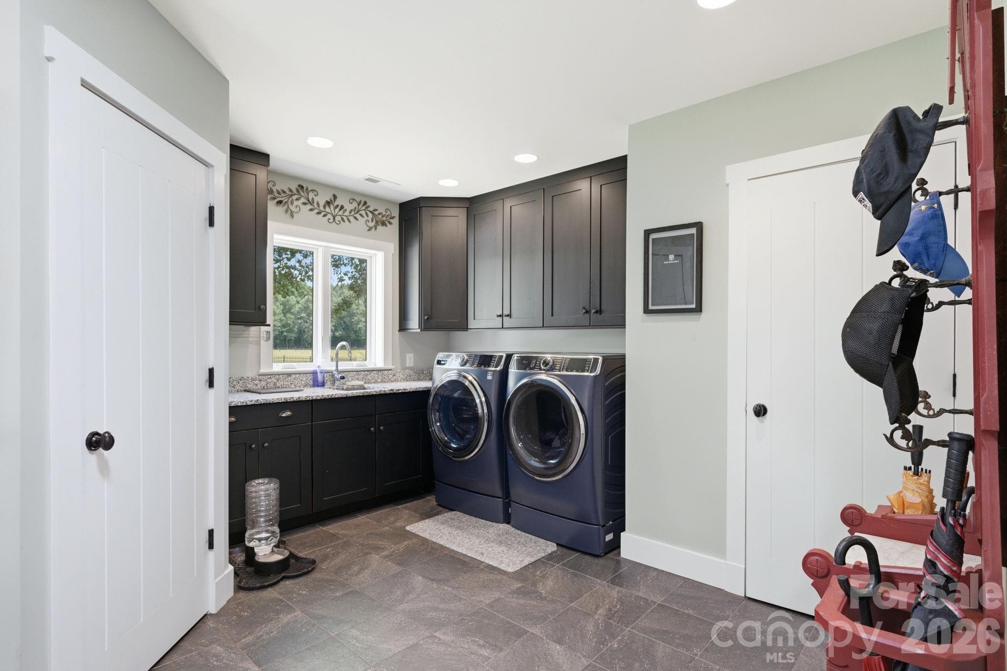 Large laundry/mud room with powder bath and large storage closet - Lancaster