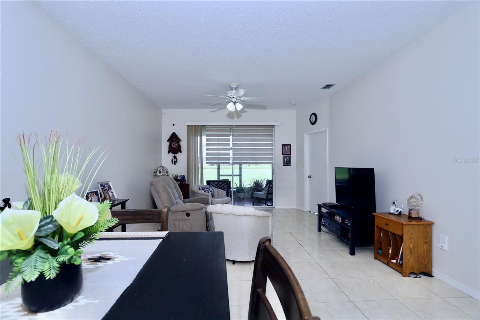 Open living and dining room - 170 CLUB VILLAS LN, KISSIMMEE