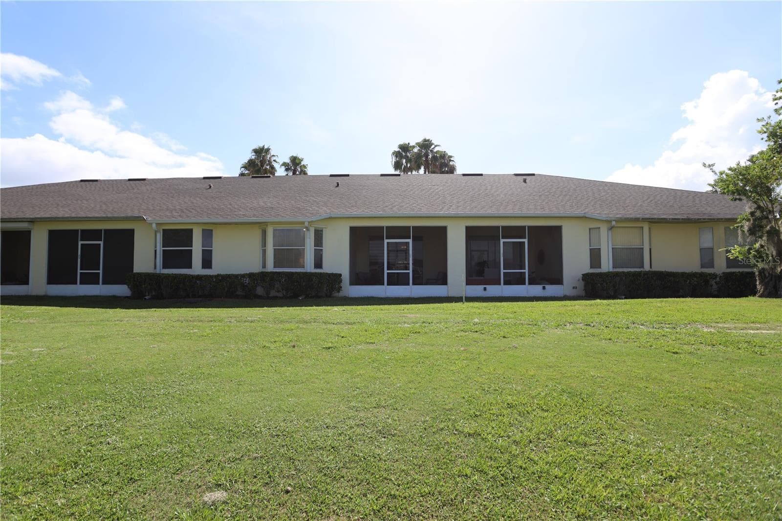 Rear of home facing 9th fairway - 170 CLUB VILLAS LN, KISSIMMEE