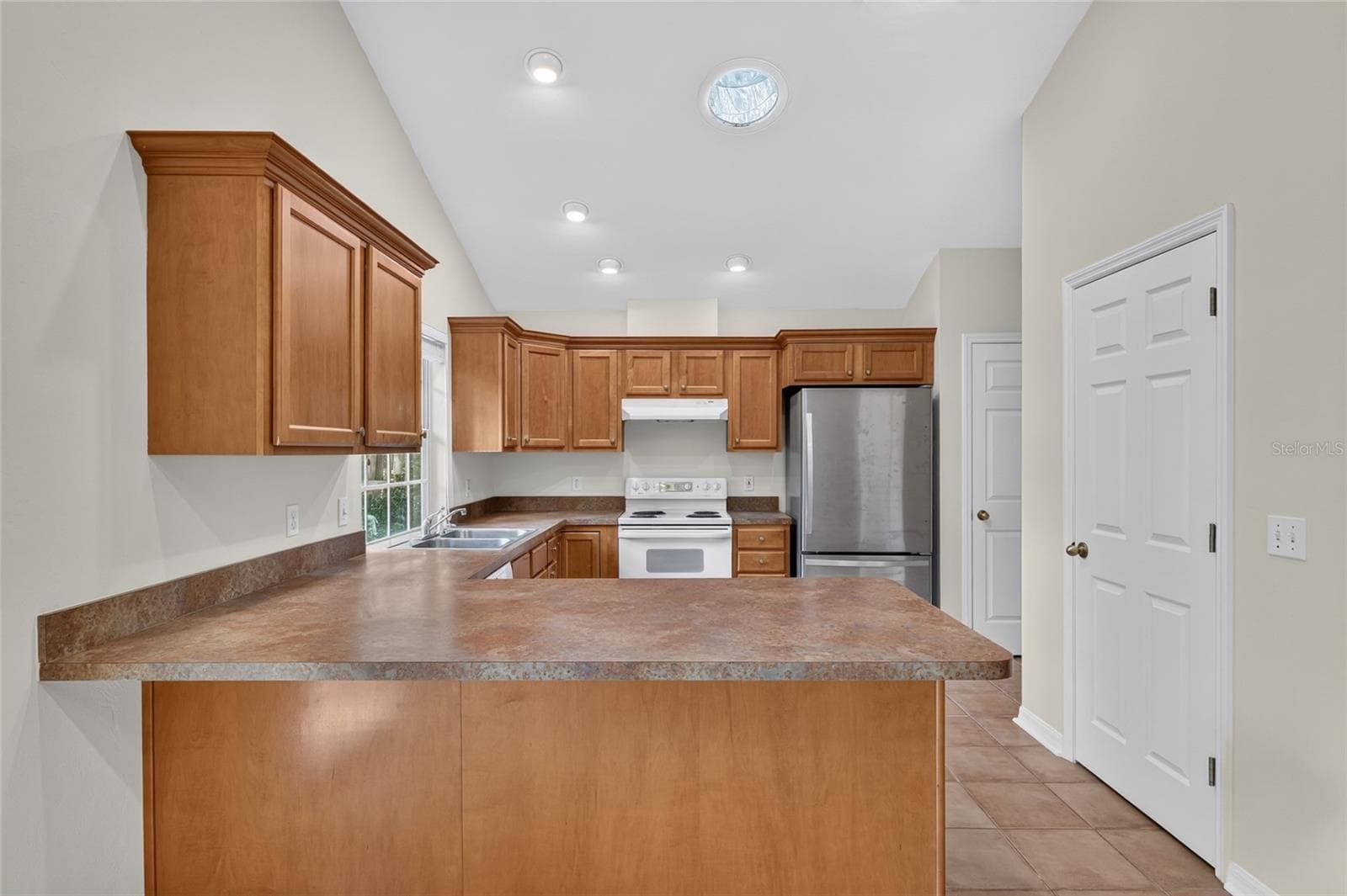 KITCHEN WITH WOOD CABINETS - 9437 SW 31ST LN, GAINESVILLE
