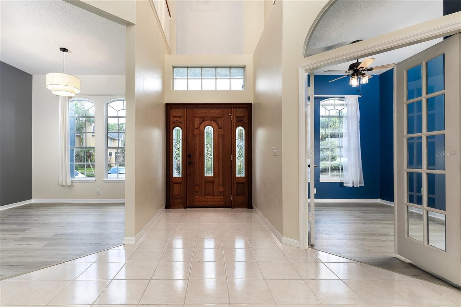 Entry door interior view showing dining area and office/5th bedroom option - 1153 OAK TREE CIR, ALTAMONTE SPRINGS
