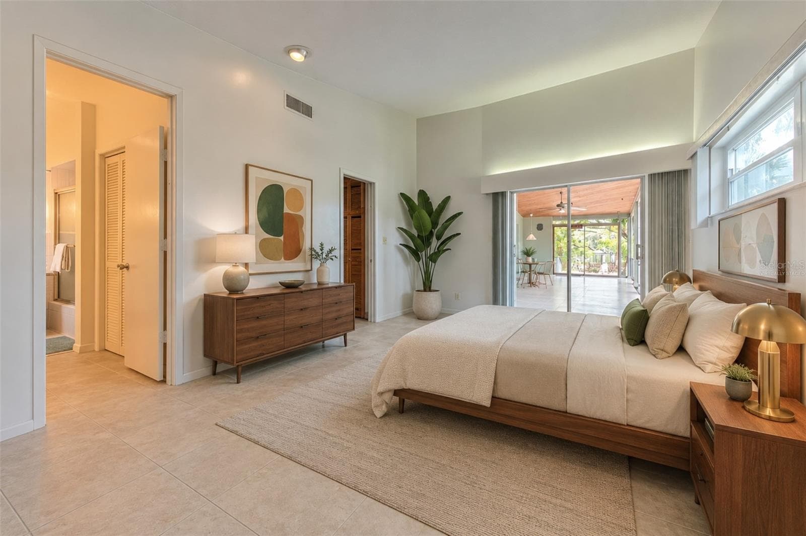 virtually staged -  master bedroom overlooking patio and waterfront - 7102 MANDY LN, NEW PORT RICHEY