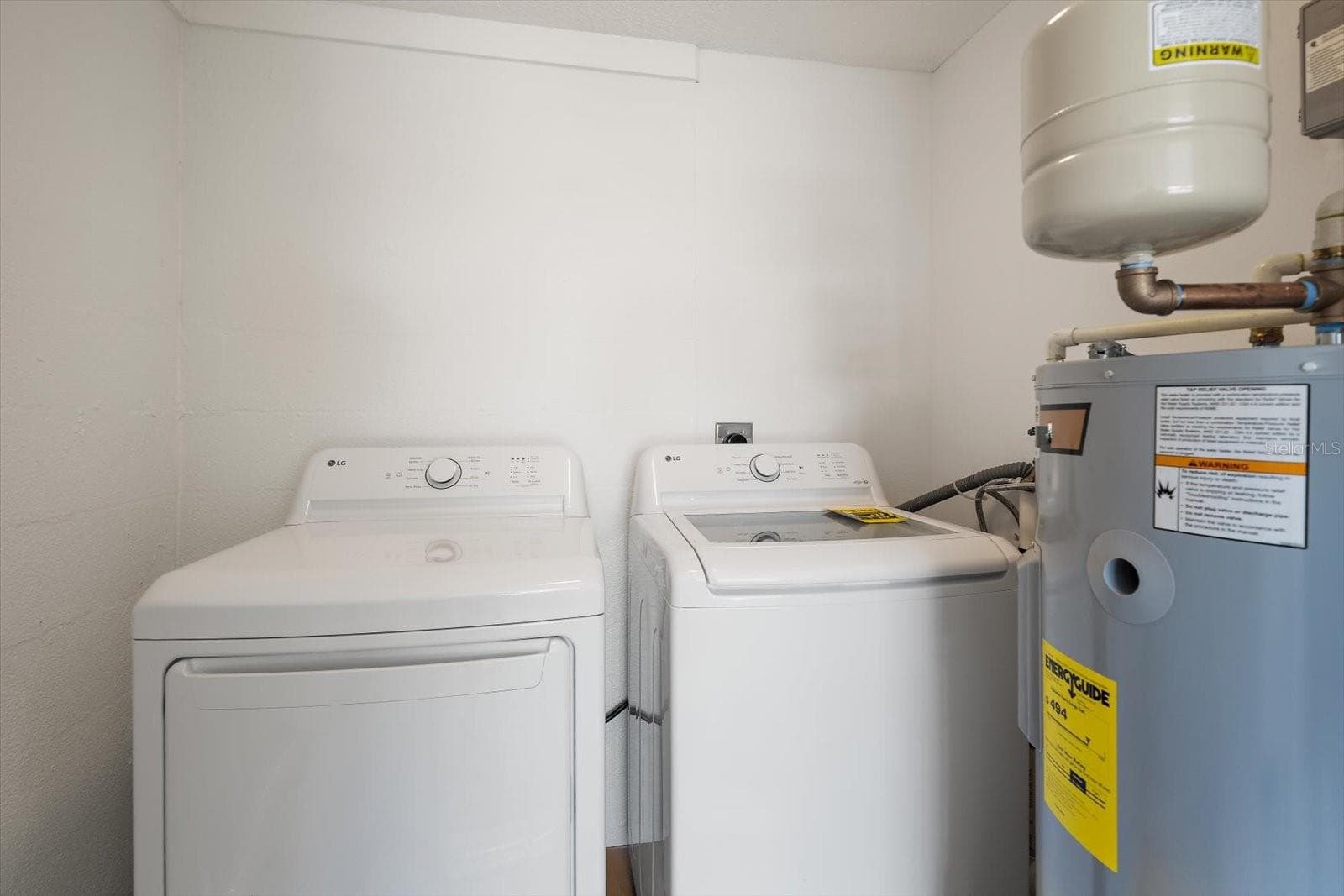 Laundry room with new washer, dryer, and water heater - 578 SPANISH DR S, LONGBOAT KEY