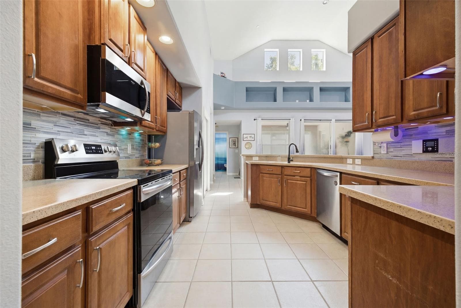 Kitchen offers so much counter space and plentiful storage as well as a breakfast bar - 6846 PINE SPRINGS, WESLEY CHAPEL