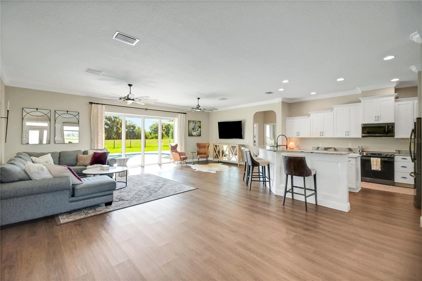 Living area opens to the kitchen - 10757 COUNTY ROAD 223, OXFORD