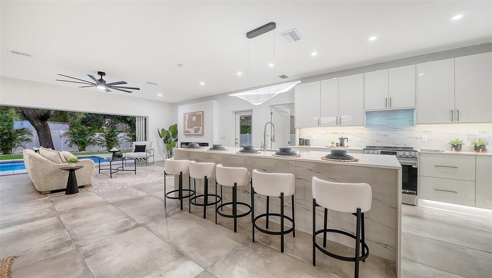 Open-concept kitchen with pool views. - 2050 EUCLID TER, SARASOTA