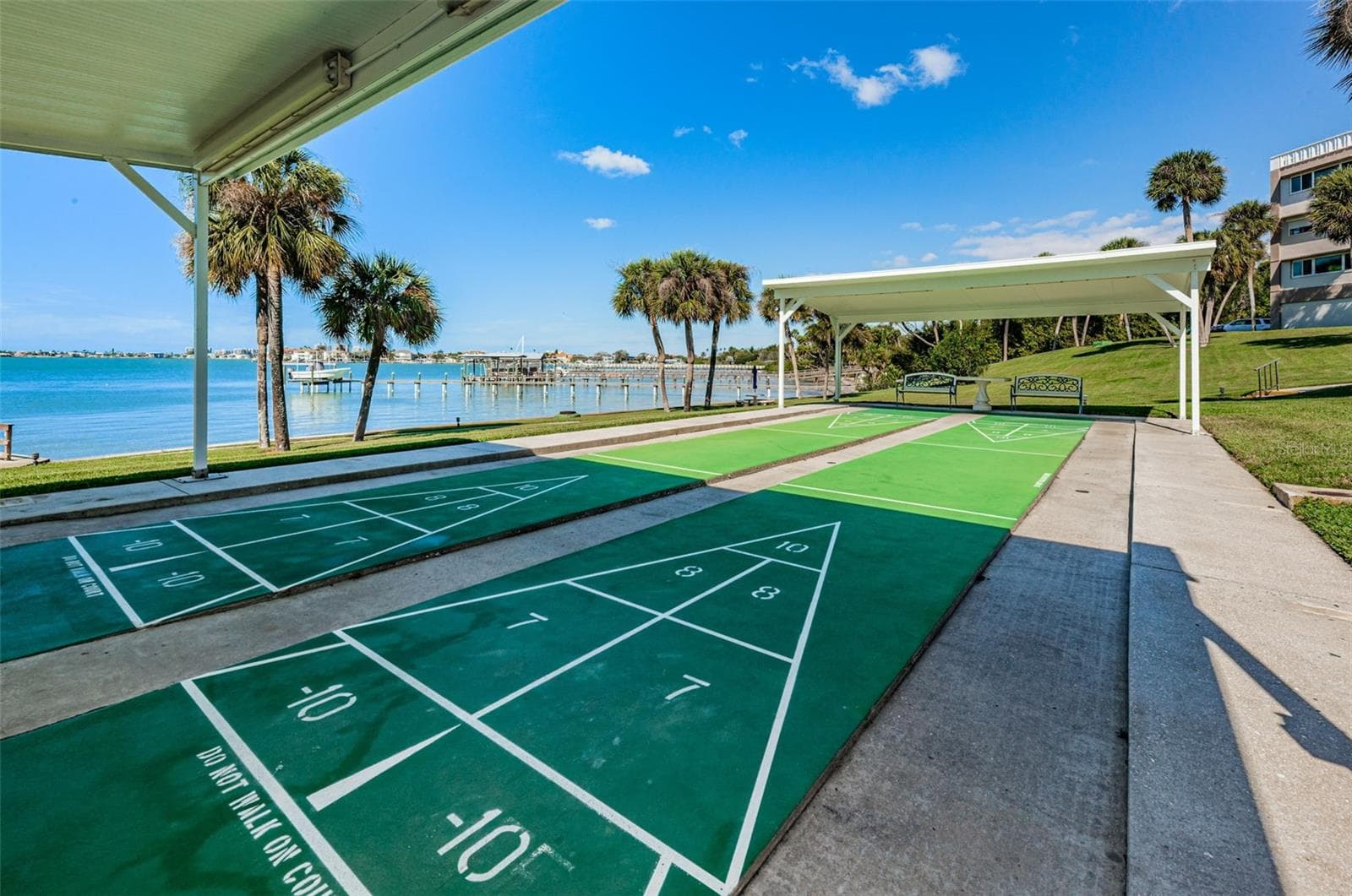 Play shuffle board with friends - 100 BLUFF VIEW DR #211C, BELLEAIR BLUFFS
