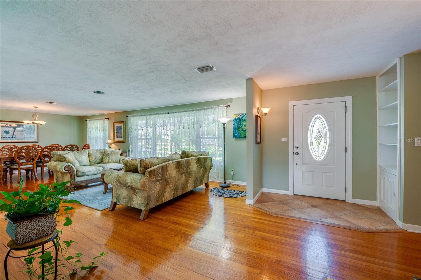 Entry showing living room and dining area - 697 JOHN ANDERSON DR, ORMOND BEACH